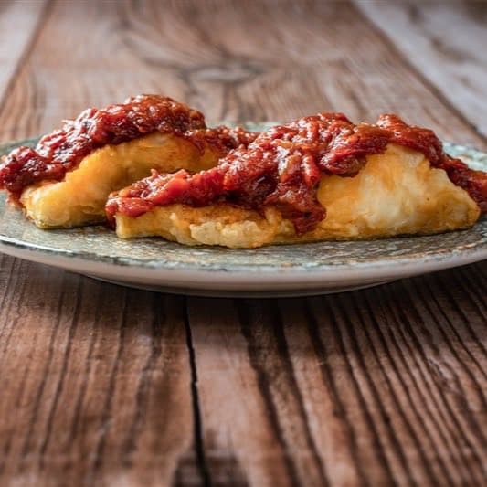 Bacalao con tomate y cebolla